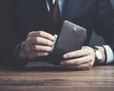 A man holding a wallet